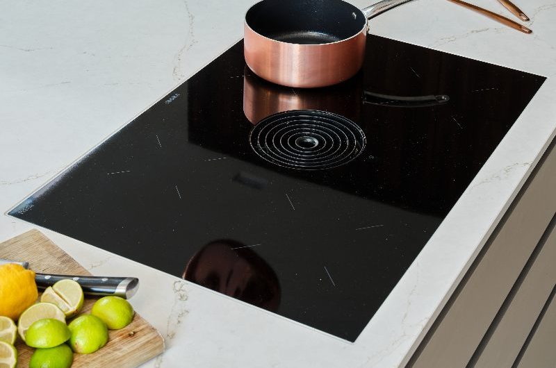 An extrator hob on an island.