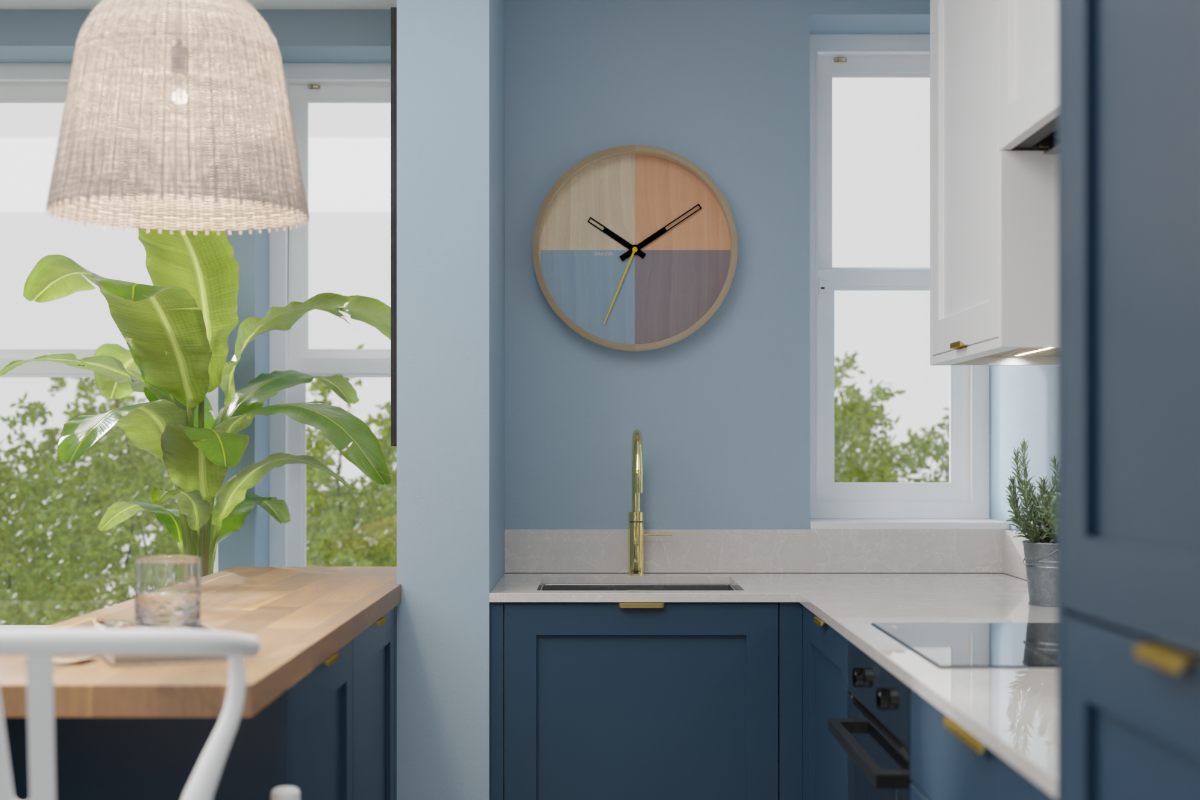 A compact sink zone with a gold tap.
