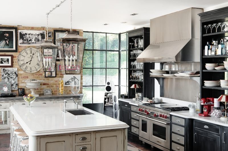 Industrial style kitchen with statement appliances as a lived-in feel.