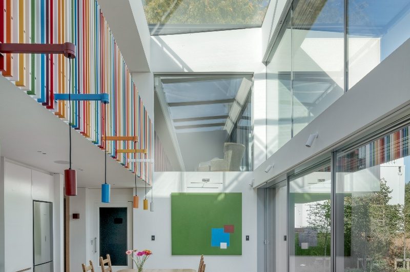 A bright kitchen extension with glazing and a skylight.
