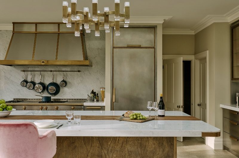 Modern and sophisticated scheme with metallic cabinetry and a statement island.