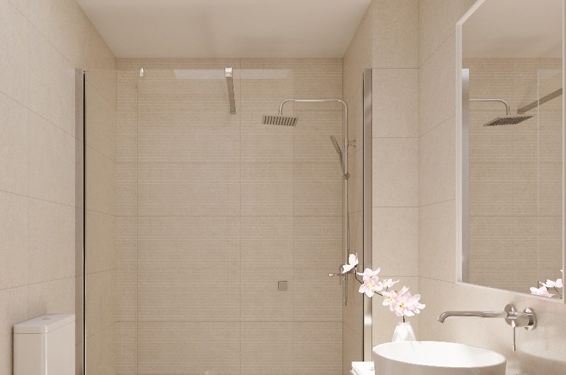 Neutral bathroom with chrome hardware and white sanitaryware.