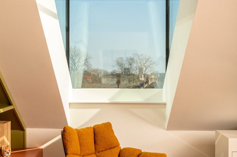 A reading nook next to a skylight.