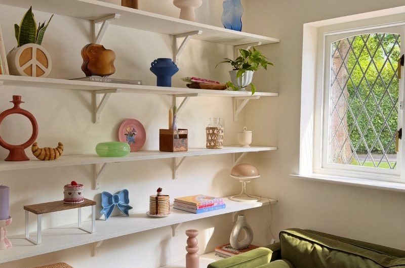 A living room with a display area.