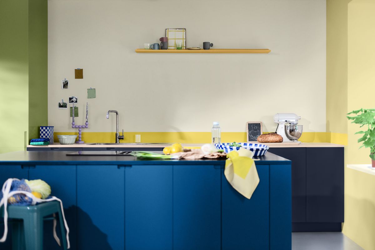 A vibrant kitchen painted in yellow, green and Dulux Colour of the Year 2026 blue.