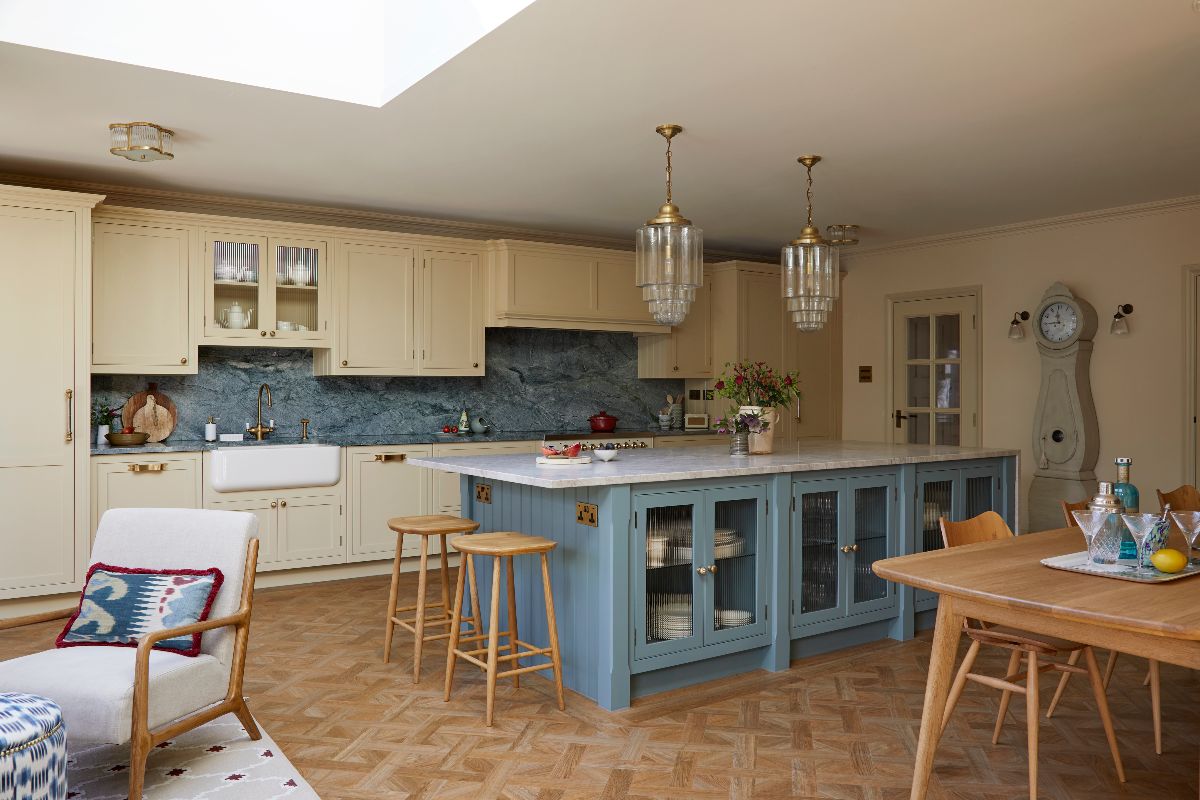 Gallery kitchen with an island, an adjoining dining zone, and seating area.