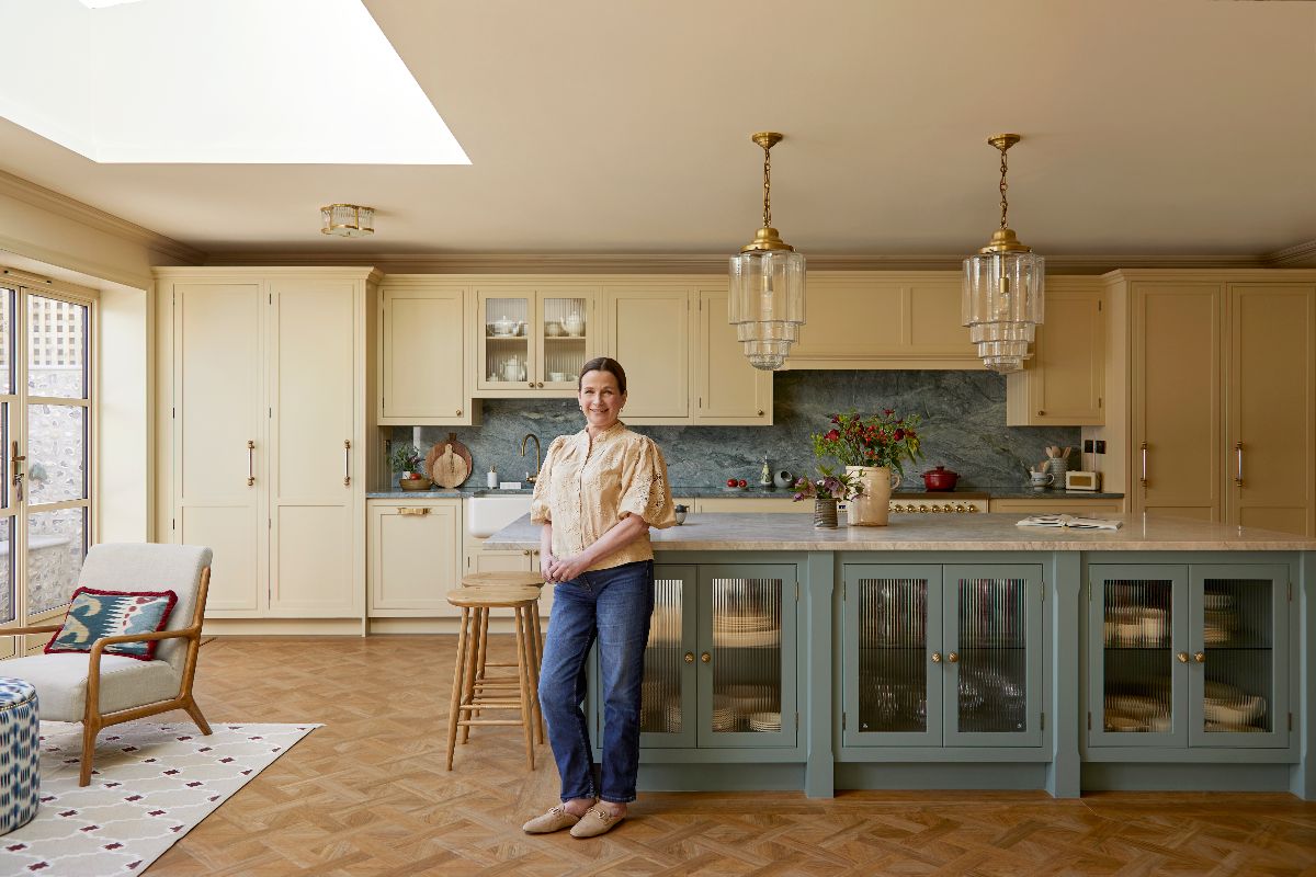 Homeowner Lisa posing in front of her kitchen island.