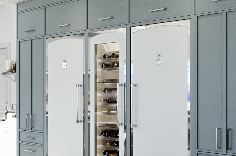 Luxury kitchen with built-in appliances for entertaining such as a refrigerator, wine cabinet and freezer.