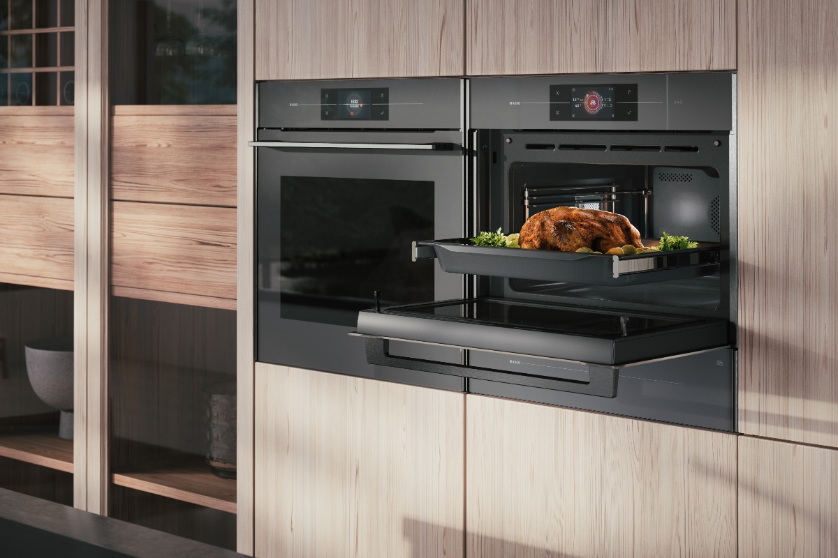 Wood cabinetry with dark built-in appliances.