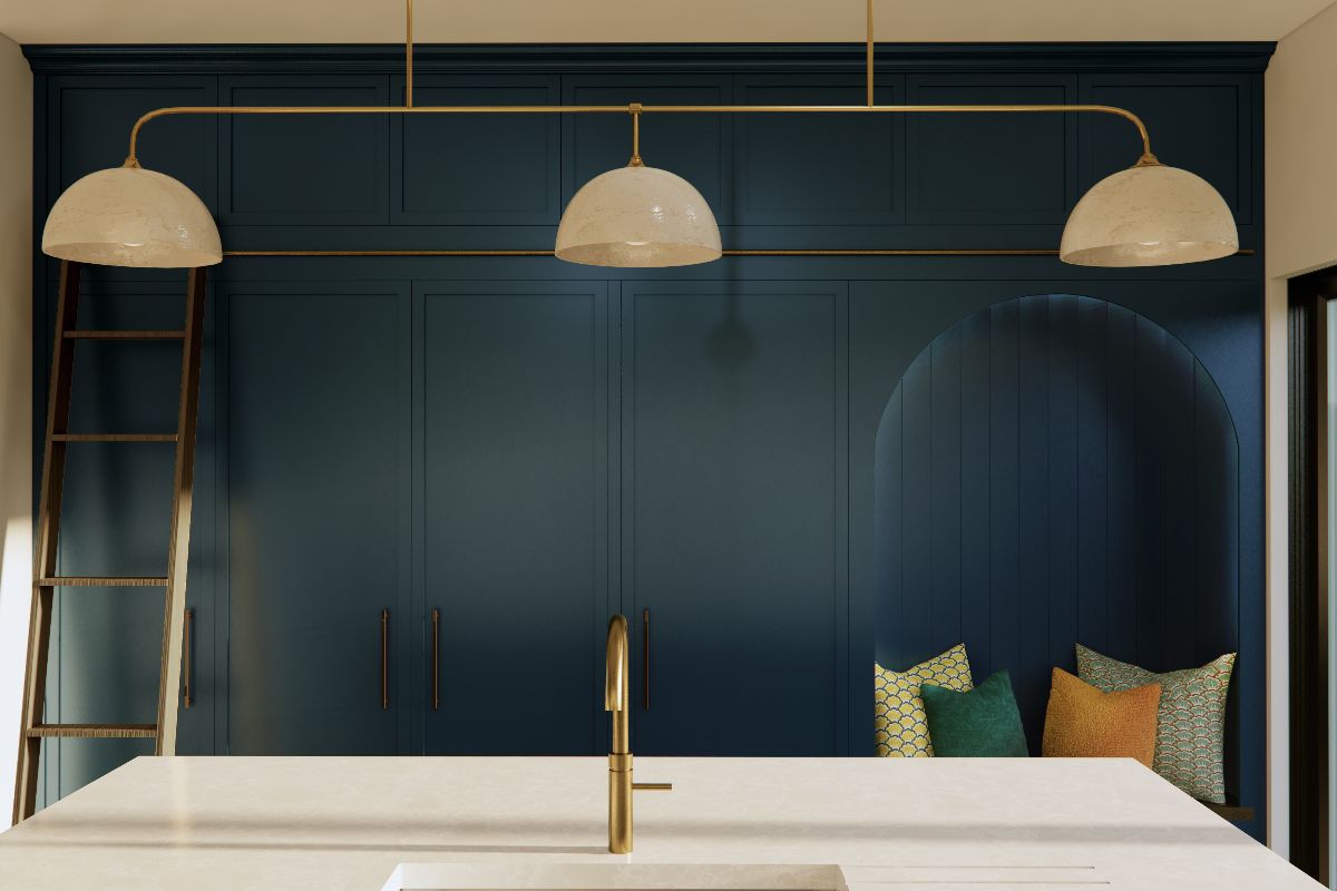 Closeup at the floor-to-ceiling cabinetry with a seating nook and ladder, next to the island.