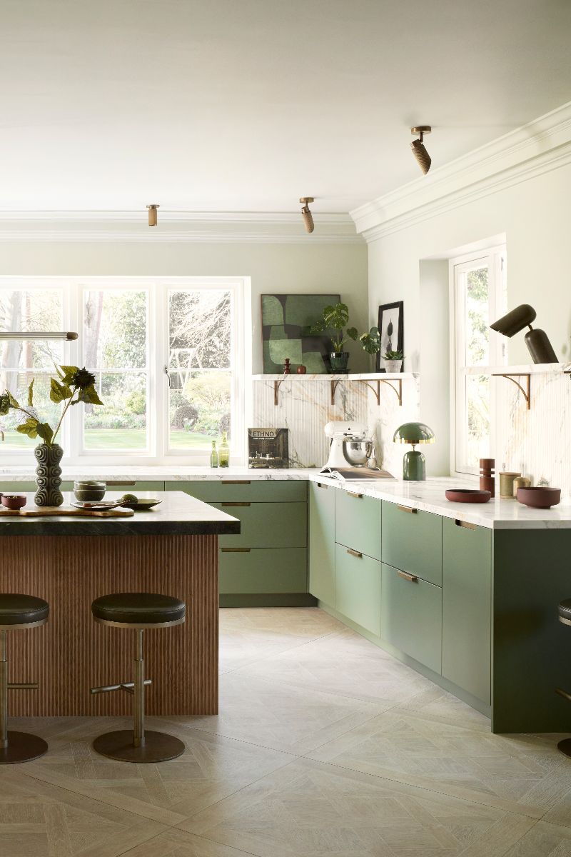 Tour this green kitchen with fluted marble and rich stones