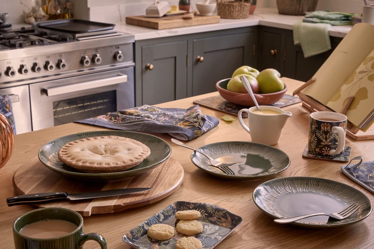Autumn tablescaoe with dark green and floral crockery.