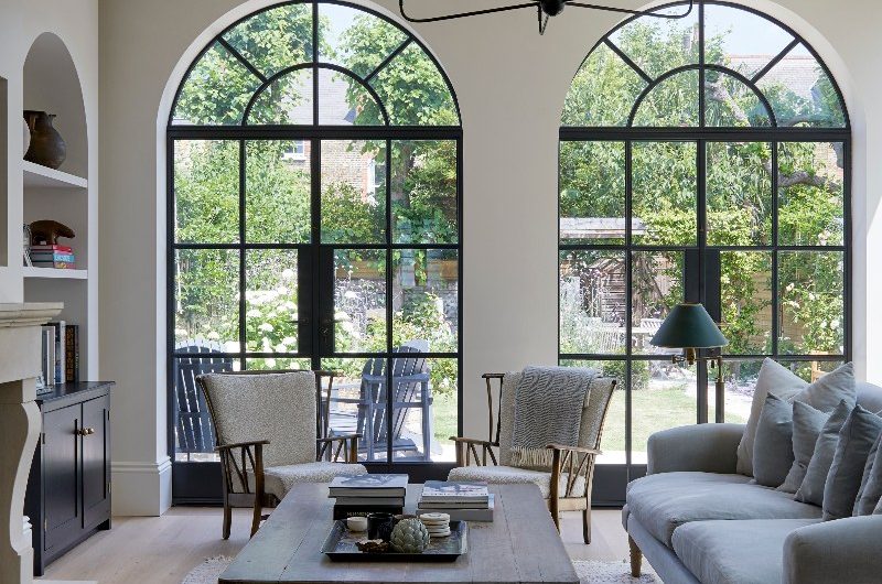 View of the sitting room with arched windows.