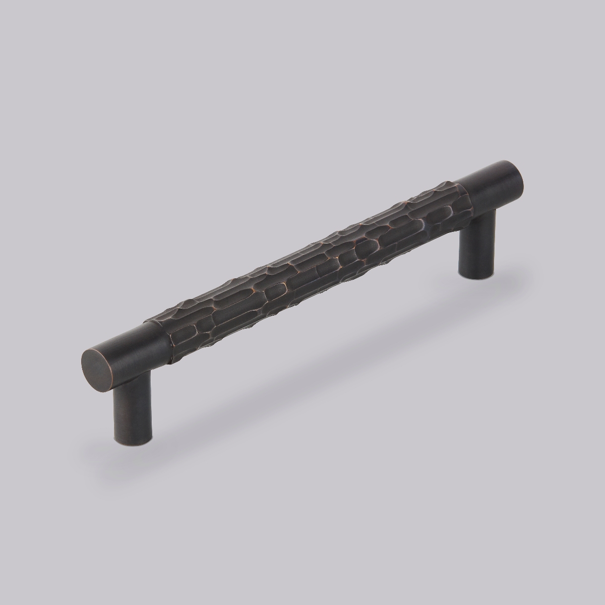 Closeup at a textured cabinet handle.