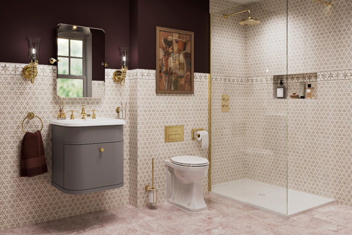 Art Deco space with patterned wall tiles, a showering zone with a white tray, enclosed by a sleek panel with gold brassware and hardware, and a sophisticated vanity zone with a wall-mounted unit and gold finishes.