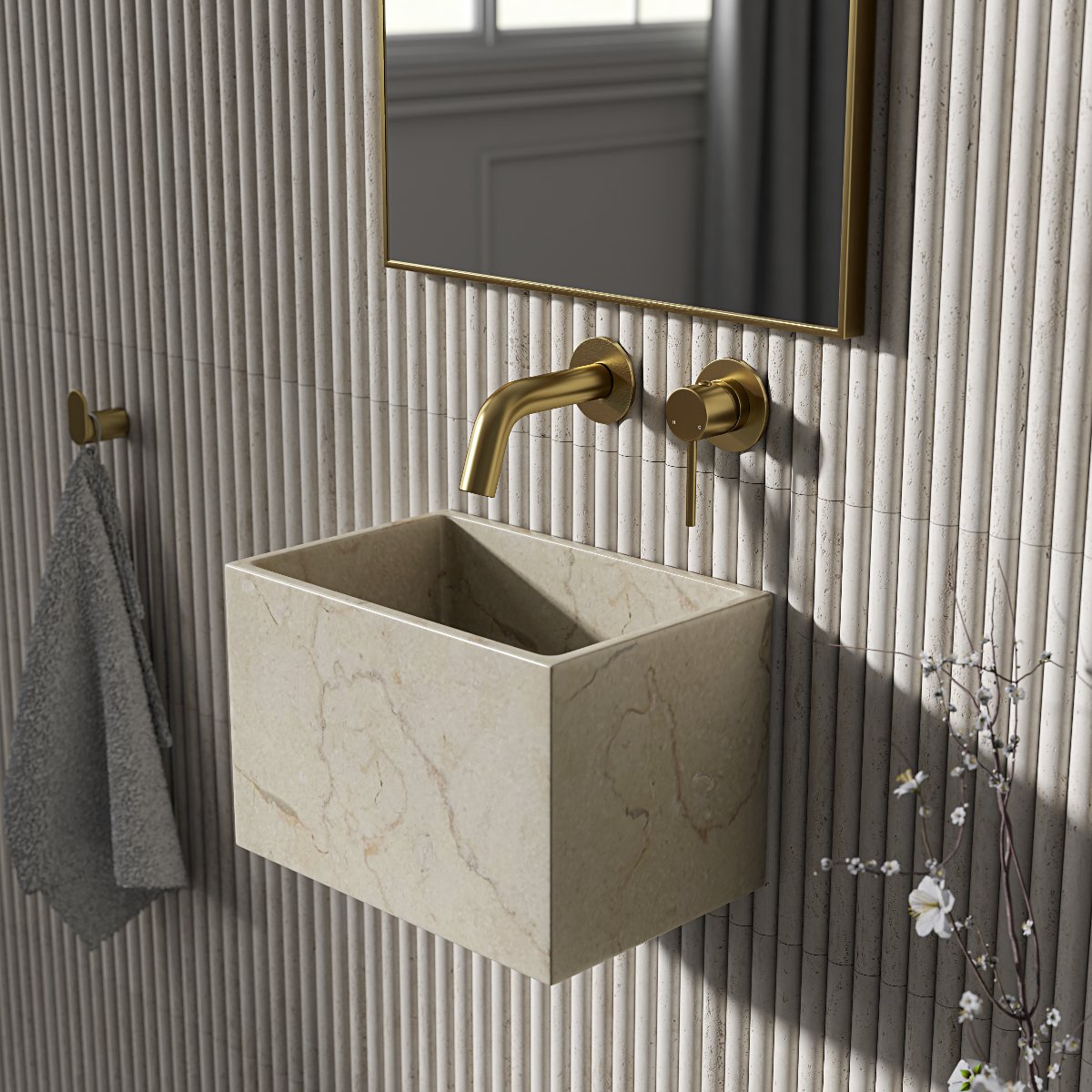 Neutral scheme with fluted tiles, wall-mounted stone basin, and gold hardware and matching mirror.