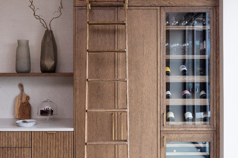 Wood interiors with a matching wood ladder with gold accents.