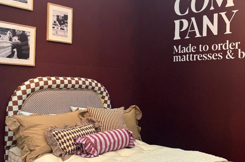 Decorex 2025 stand with a bespoke checkered bedframe.
