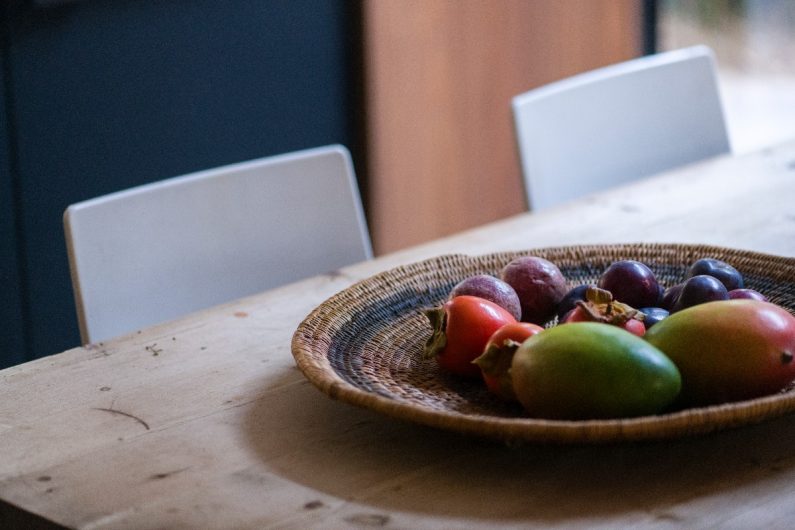 Closeup at the dining table with a wood worktop.