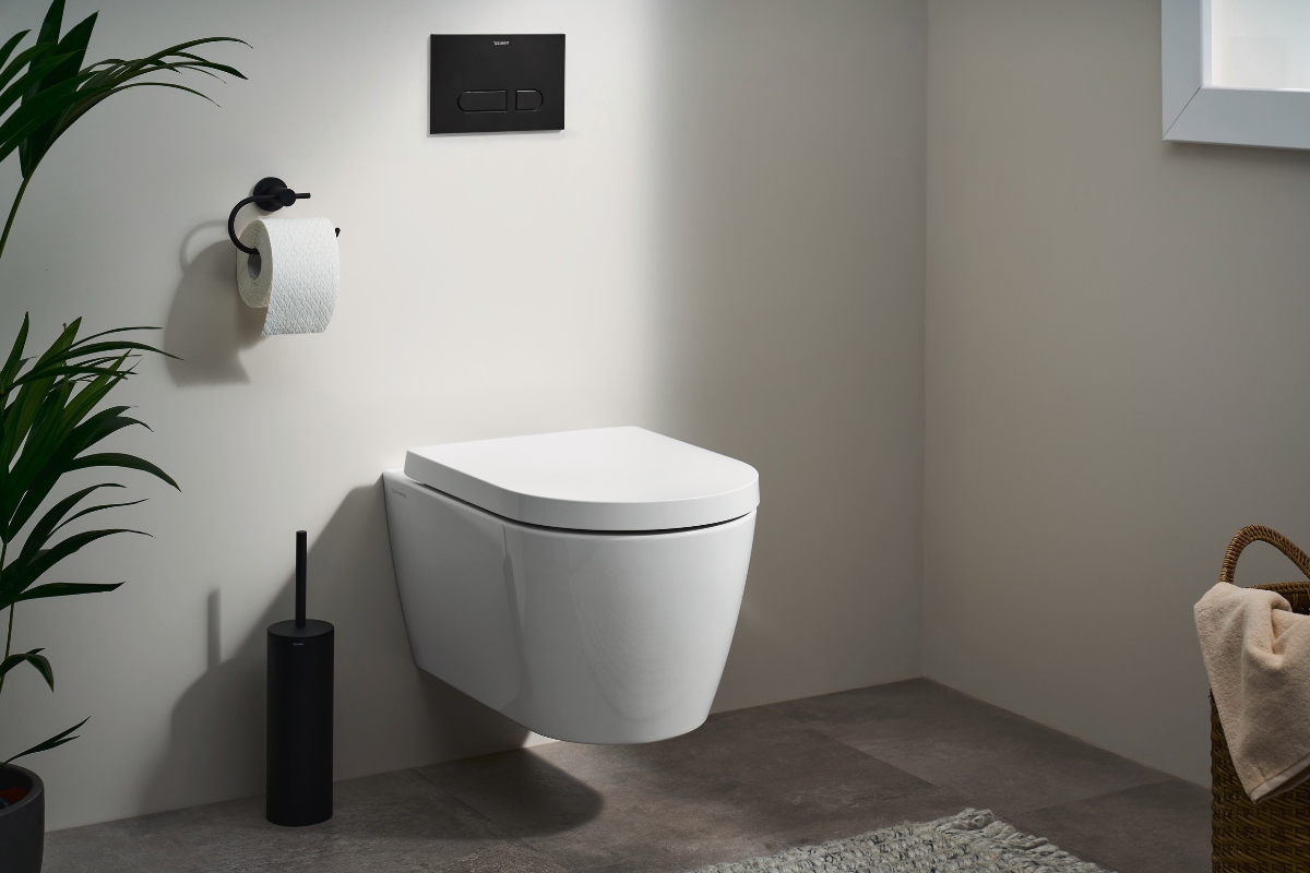 Wall-mounted shower toilet in a neutral bathroom.