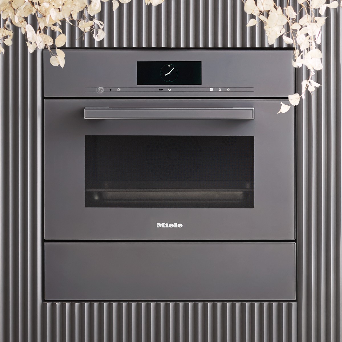 Closeup at a combi oven with a warming drawer.