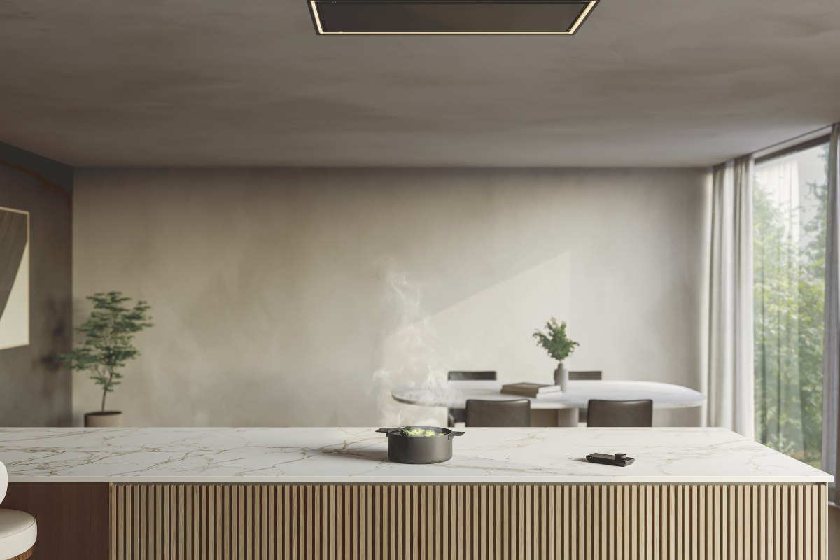 A neutral kitchen with a fluted wood island, veiny worktops, invisible hob and matching invisible extractor.