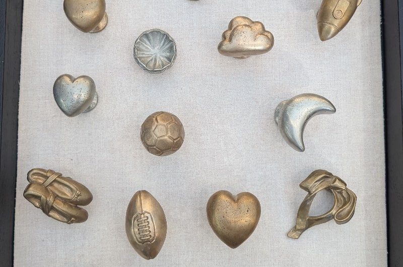 A flatlay of knobs and hooks at Decorex 2025.