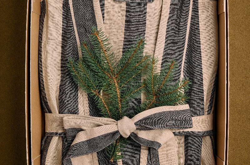 A striped bath robe packed for Christmas. 