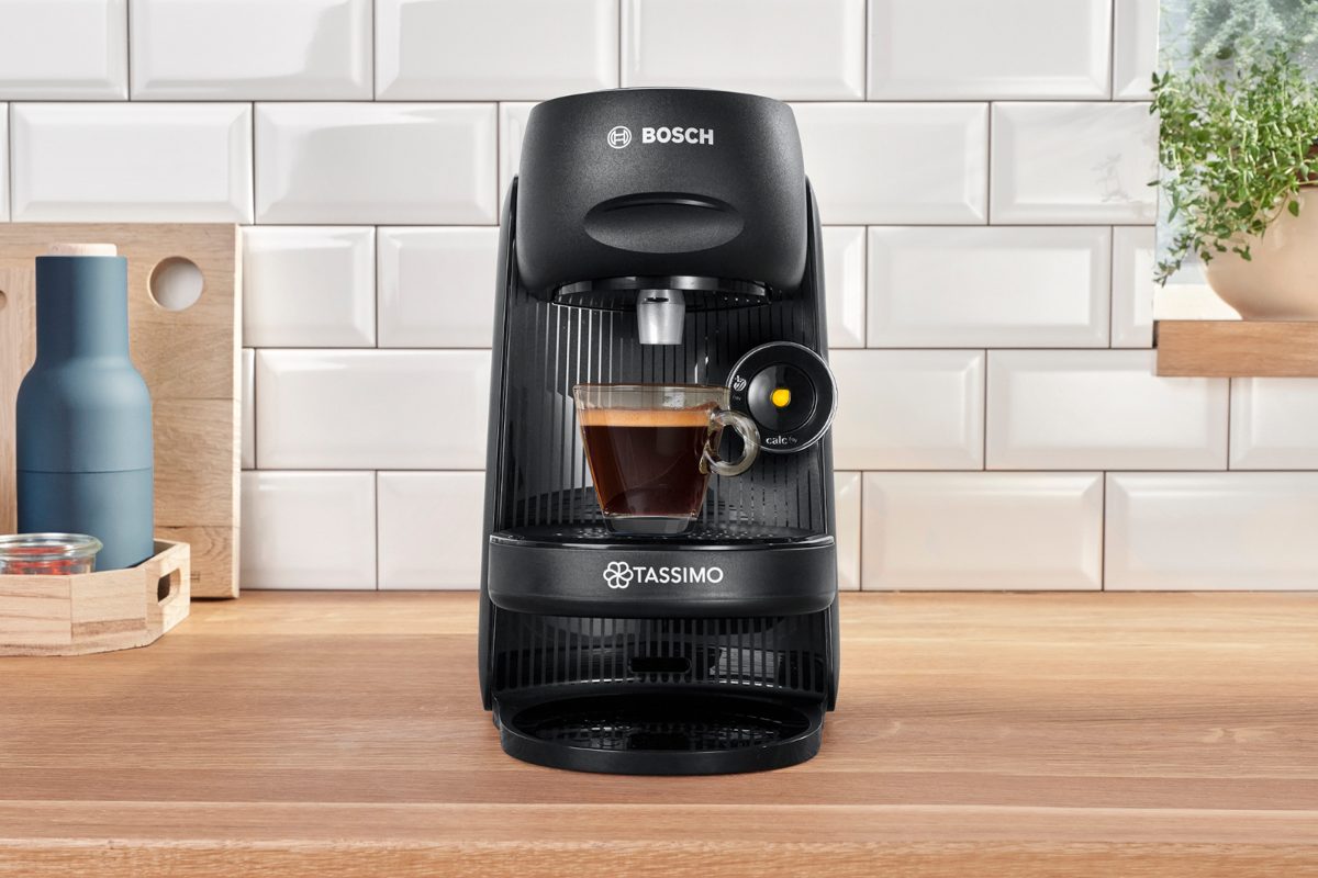 A chic kitchen design with a countertop coffee machine in black.