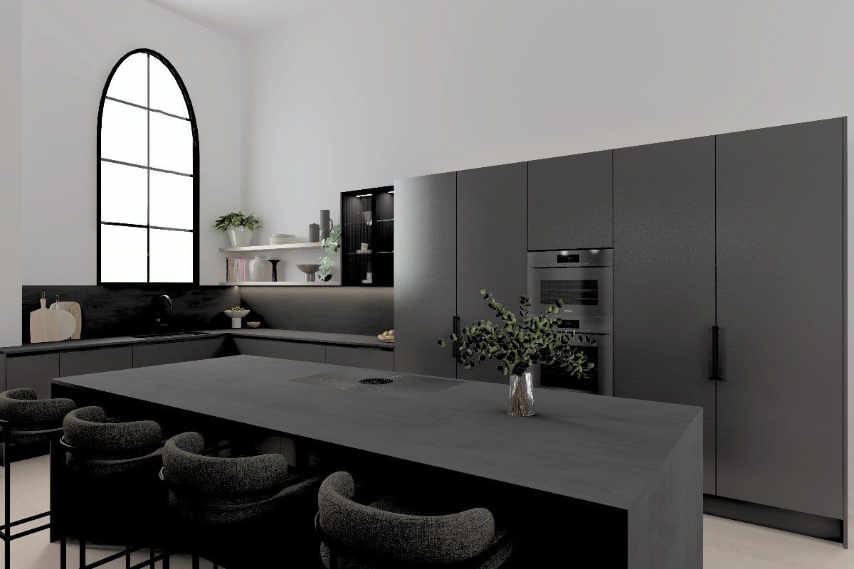 A contemporary kitchen design with dark handleless units, a central island with seating and a hob, tall ceilings and Gothic windows.