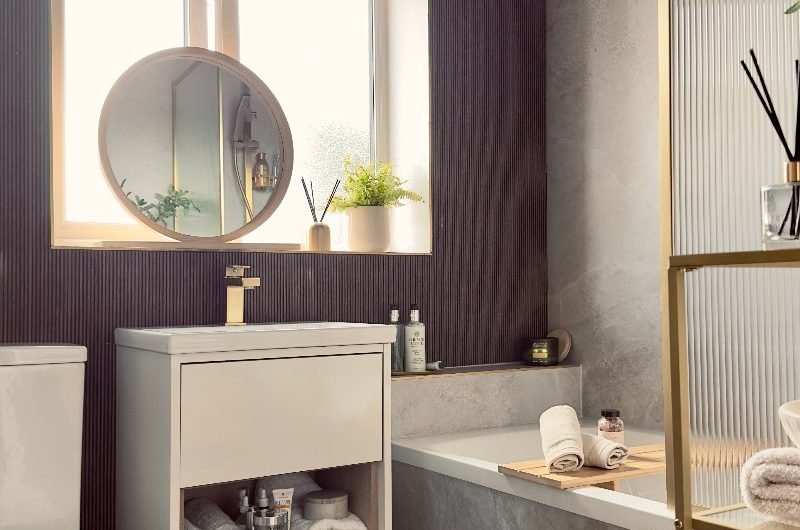 A spa-like bathroom renovation with a fitted tub and wood wall panelling.