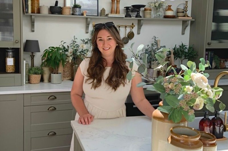 Portrait of a homeowner in her kitchen.