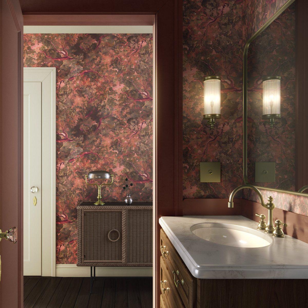 A dark and moody bathroom with wood furniture, patterned wallpaper, warm lighting and polished brassware.