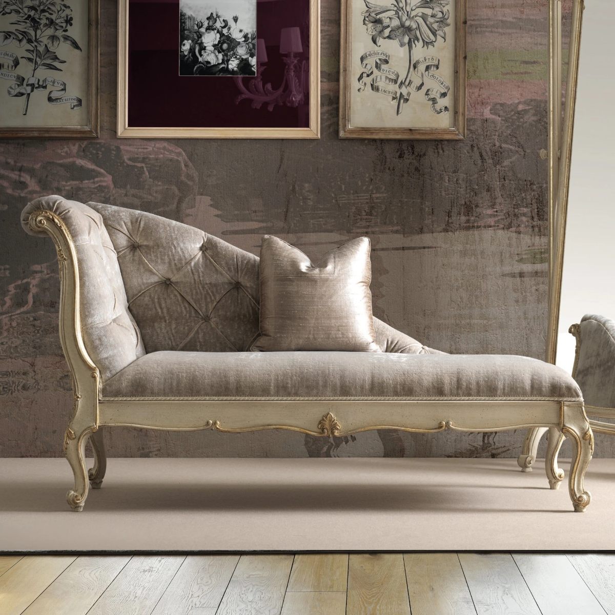 A Rococo chaise longue with ornate detailing and gold finishes in a glamorous scheme.